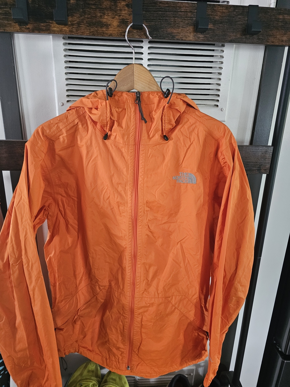 The North Face Black and White Logo Inner Neck Label on Orange Shell